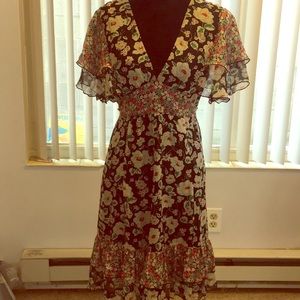 Dark floral dress with ruffles.